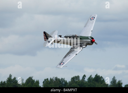 Old trainer plane North American AT-6 Texan in flight during an airshow in Alaska Stock Photo