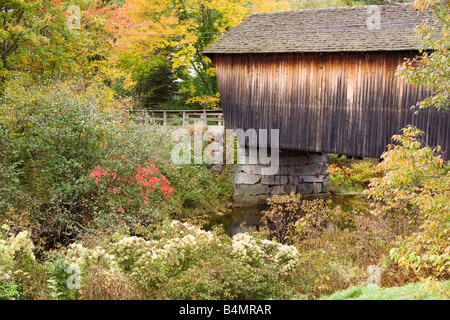 A wooden covered bridge in Bradford, New Hampshire on an autumn afternoon Stock Photo