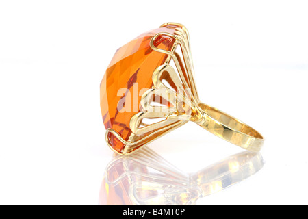 gold ring with huge gem jewelry accessories macro isolated reflected Stock Photo
