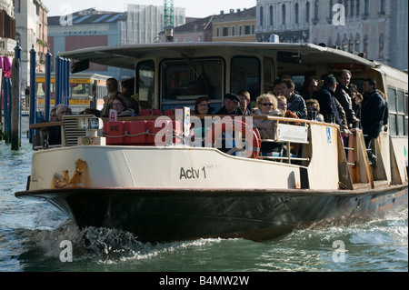 Vaporetto with Venetian citizens and tourists on the Grand Canal in Venice, Italy Stock Photo