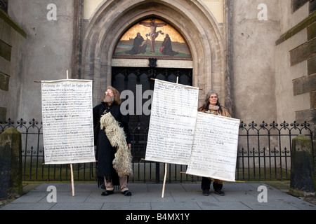 Two people proselytize as a part of Reformation Day celebrations in Wittenberg, Germany. Stock Photo