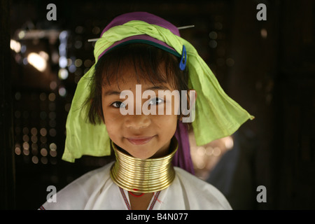 Portrait of a young Longneck girl Approximately 300 Burmese refugees in Thailand are members of the indigenous group known as the Longnecks The largest of the three villages where the Longnecks live is called Nai Soi located near Mae Hong Son City Longnecks wear metal rings on their necks which push the collarbone down and extend the neck They are a tourist attraction Tourists visit Nai Soi to take pictures of the Longnecks and buy their handicrafts The villages are criticized by human rights organizations as human zoos Stock Photo