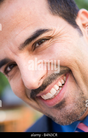 Businessman's smiling face outdoors (selective focus) Stock Photo
