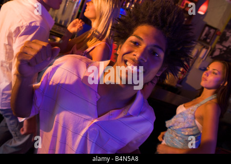 Young people dancing in a bar Stock Photo