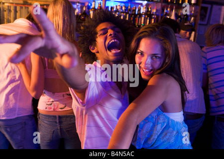 Young people dancing in a bar Stock Photo