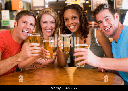 Two couples having beer together Stock Photo
