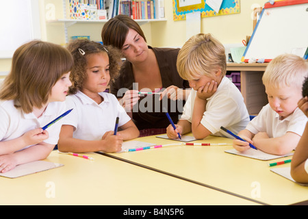 Students in math class with teacher Stock Photo
