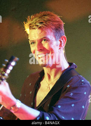 Singer David Bowie July 1997 Playing the guitar live on stage at the Glasgow Barrowlands concert Stock Photo