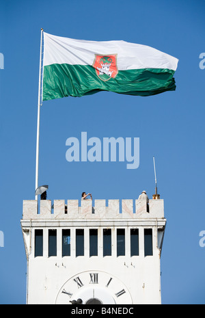 Flag with court of arms of Lubljana town flays on the top of Lubljana medieval castle Republic of Slovenia Europe Stock Photo