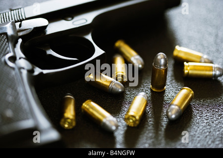 Close up of Beretta 92F handgun with 9mm ammunition Stock Photo