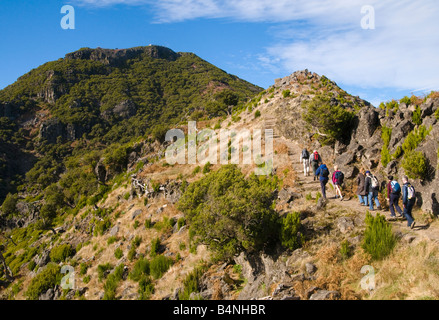 Walkers on constructed path to Pico Ruivo Madeira s highest summit Stock Photo