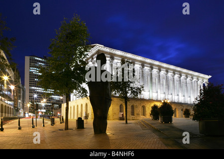 The Iron Man standing next to the Town Hall in Birmingham at night Stock Photo