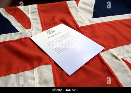 British Citizenship Certificate displayed on a Union Jack Stock Photo