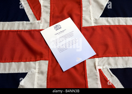 British Citizenship Certificate displayed on a Union Jack Stock Photo