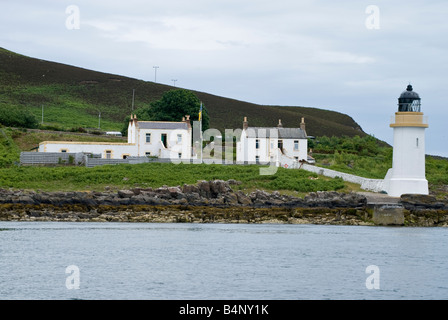 The lighthouse and keepers cottages on Holy Island Scotland Stock Photo