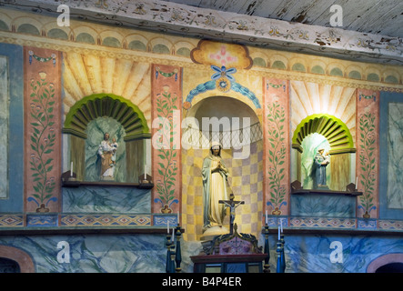 Statues of Mary Joseph and St Anthony at main altar at church in La Purisima Mission State Park near Lompoc California USA Stock Photo