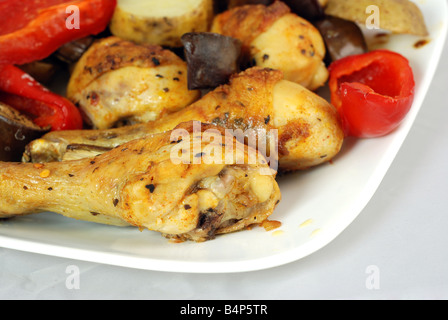 Grilled chicken on a white plate with vegetables Stock Photo