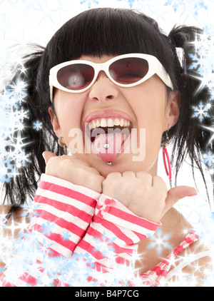 pink striped asian girl portrait with snowflakes Stock Photo