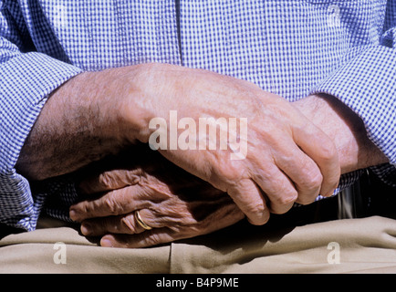New York City Senior Man Sitting Hands Clasped Stock Photo
