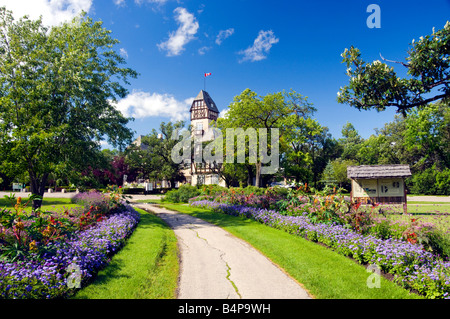 The pavilion at the Assiniboine Park with a pathway lined with decorative flowers in Winnipeg Manitoba Canada Stock Photo