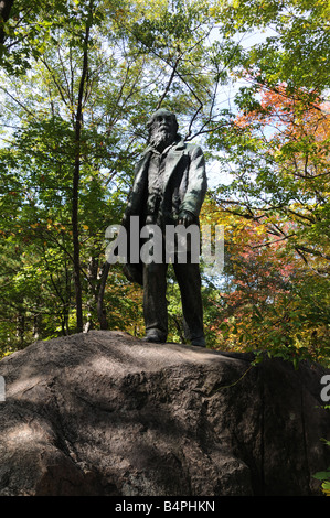 A statue of poet Walt Whitman stands in New York State's Harriman State Park bordering the Hudson River, north of New York City. Stock Photo