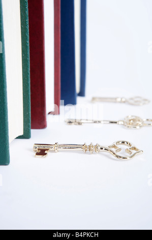 Keys by of row of books Stock Photo