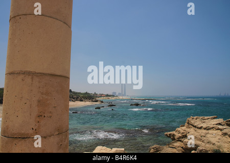 Caesarea, Israel. An ancient Roman pillar overlooking the Hadera Power Plant. Stock Photo