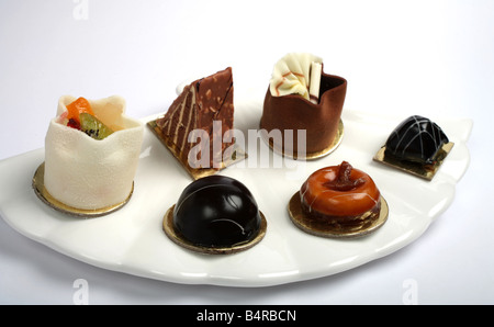 A plate of petits fours cakes close up Stock Photo