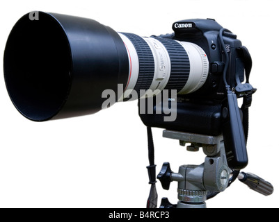 Canon digital SLR camera mounted on tripod with telephoto zoom lens and electronic cable release fitted Stock Photo