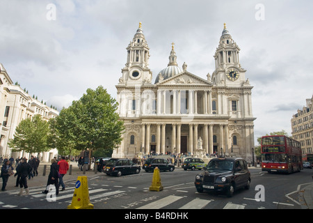 St Pauls Cathedral exterior and dome with red bus and black taxi London England UK United Kingdom GB Great Britain British Isles Stock Photo