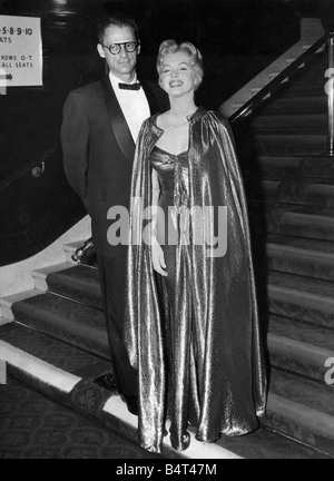 Actress Marilyn Monroe pictured with her playwright husband Arthur Miller arriving at the Empire Theatre Leicester Square for the Royal Film Performance of the British film The Battle of the River Plate 29 10 56 Stock Photo