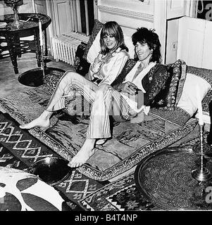 Rolling Stones guitarist Keith Richards seen here with Antia Pallenberg at their Chelsea home celebrate the Home Office decision to allow her to stay in the UK Stock Photo