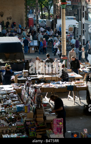 Stallholders and bargain hunters shopping in Preston's old covered market Lancashire, northern england UK Stock Photo