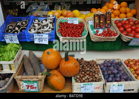 Fresh local grown fruit and vegetables on sale at the Barnstaple Pannier market in North Devon England. Stock Photo