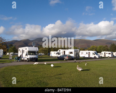 A campsite with motor homes and caravans in Keswick Cumbria England Stock Photo