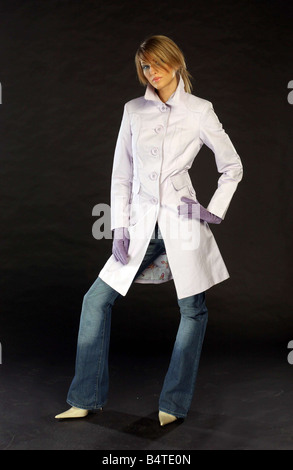 Raincoat Fashion February 2005 model Henrietta wearing lilac trench coat Stock Photo