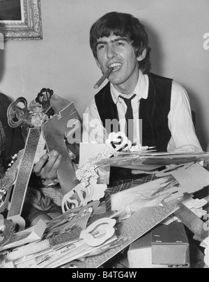 Beatle george harrison smoking cigar hi-res stock photography and images