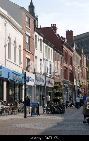 People shopping in Friargate pedestrianised street Preston city centre Lancashire UK Stock Photo