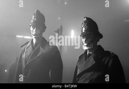 Policeman in smog mask December 1962 PC John Finn right from Snow Hill Police Station with a colleague wearing smog masks Smogs Stock Photo