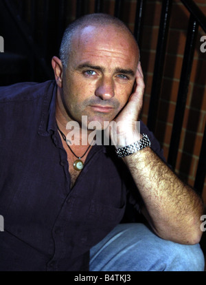 The Bill Actor Bruce Byron September 2004 In London Sitting on steps Mirrorpix Stock Photo