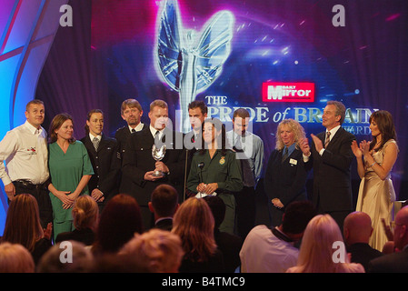 Daily Mirror Pride of Britain Awards in London October 2005 Beyond the Call of Duty Award winners including members of the Metropolitan police and emergency services who helped people afterthe London bombings on July 7th On stage leading the applause is Prime MInister Tony Blair and host Carol Vorderman Stock Photo