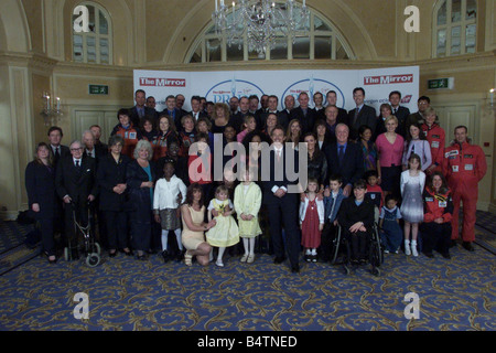 The Mirror Pride of Britain Awards 2000 winners L R Back Mark Blomfield Jamioe Blackhall Michael Currin Sally Cox Sgt Duncan Manners Pc Drek Worsfold Isnp Steve Gregory Carl Fallowfiled Martin McTigue Middle Ian Botham Tom Tracey Michael Foale Gehane Gourdelier Mark Taylor Colin Adey Simon Weston Steven Niland Ron Dowson Alistair Mulchay Emma Stopford Major Damar Ghale Middle Front Patrick Moore Caroline Hamilton Zoe Hudson Pom Oliver Ann Daniels Rosie Stancer Doreen Lawrence Natalie Appleton Devina McCall Heather Clark Kathy Cassidy Chris tarrant Ashanta Rai Lisa Potts Josie Russell Fiona Stock Photo