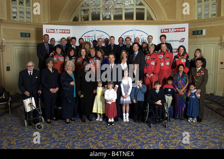 Mirror Pride Of Britain Awards 2000 Winners The full line up at this year s Pride of Britain Awards at London s Hilton Hotel today Tuesday April 11 2000 L R Back Ian Botham Mark Blomfield Tom Tracey Jamie Blackhall Michael Foale Michael Currin Sally Cox Gehane Gordelier Sgt Duncan Manners Mark Taylor Simon Weston Pc Derek Worsfold Colin Adey Isnp Steve Gregory Stephen Niland Carl Fallowfield Ron Dowson Chris Tarrant Alastair Mulcahy Emma Stopford Martin McTigue and Major Damar Ghale Middle Front Piers Morgan Patrick Moore Chris Evans Caroline Hamilton Zoe Hudson Pom Oliver Ann Daniels Rosie Stock Photo