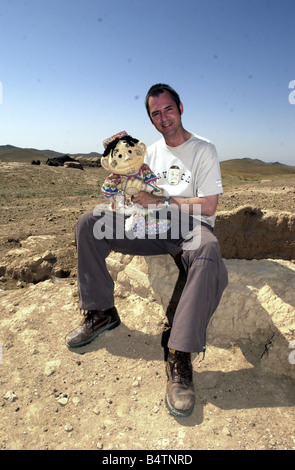 Actor Neil Morrissey pictured in Afghanistan with the No Strings charity teaching mine awareness to children using puppets June Stock Photo