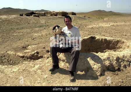 Actor Neil Morrissey pictured in Afghanistan with the No Strings charity teaching mine awareness to children using puppets June Stock Photo