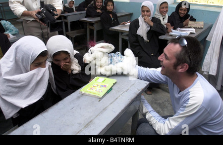 Actor Neil Morrissey pictured in Afghanistan with the No Strings charity teaching mine awareness to children using puppets June Stock Photo