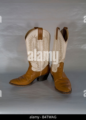 A pair of embroidered high heeled high topped western cowboy boots made in Mexico Stock Photo