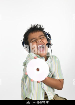 Asian boy enjoying music Stock Photo