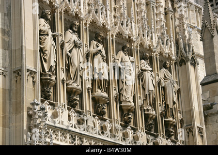 City of Gloucester, England. Close up view of the religious sculptures above the main entrance of Gloucester Cathedral. Stock Photo