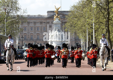 Military Band marching playing at Changing the Guard in front of the Victoria Memorial and Buckingham Palace SW1 London England Stock Photo